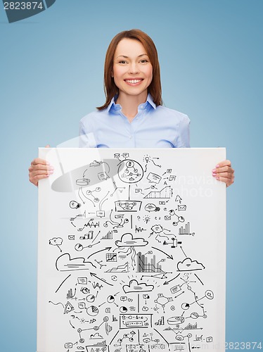 Image of smiling businesswoman with plan in white board