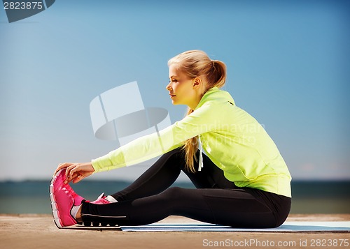 Image of woman doing sports outdoors