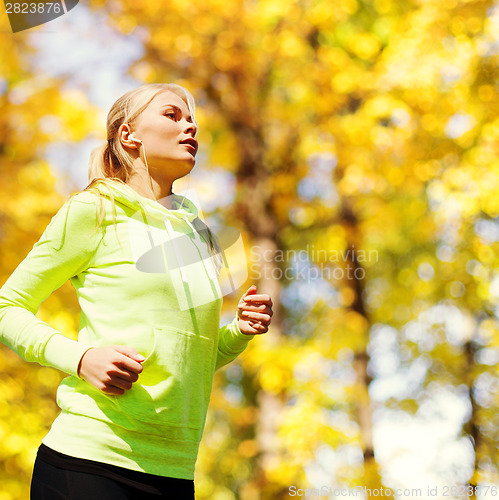 Image of woman doing running outdoors