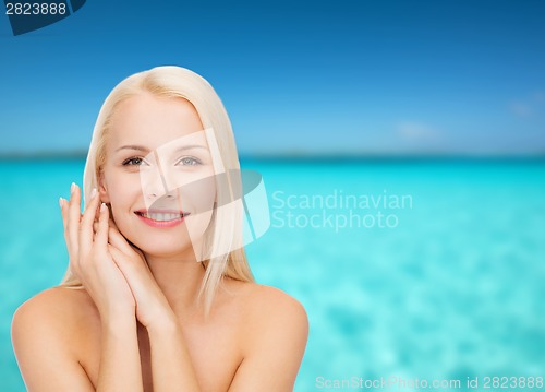 Image of face and hands of happy woman