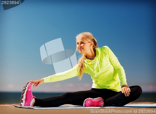 Image of woman doing sports outdoors