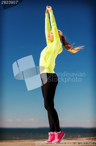Image of woman doing yoga outdoors