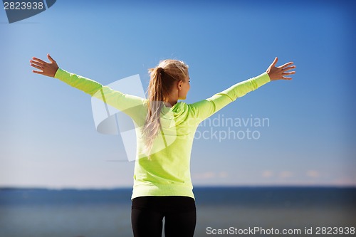 Image of woman doing sports outdoors