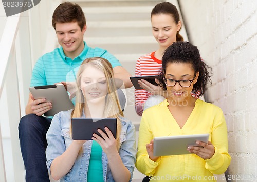 Image of smiling students with tablet pc computer