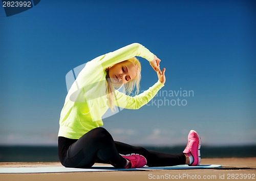 Image of woman doing sports outdoors