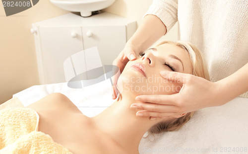 Image of beautiful woman in massage salon