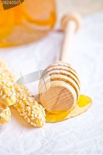 Image of grissini with sesame seeds and honey 