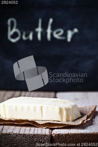 Image of fresh butter and blackboard 