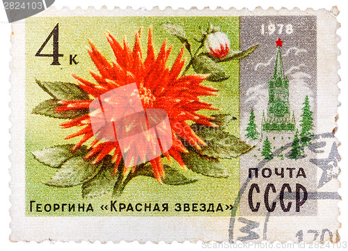 Image of Stamp printed in Russia shows Dahlia Red Star and Spasski Tower