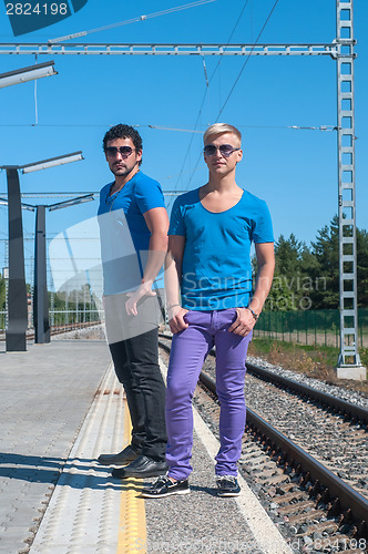 Image of Two young men standing on the platform