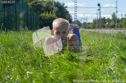 Image of Handsome young man on the grass