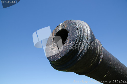 Image of Antique cannon at blue sky