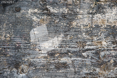 Image of Weathered tarred wooden surface