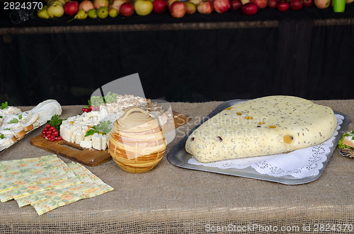 Image of homemade organic curd cheese with poppy on table 