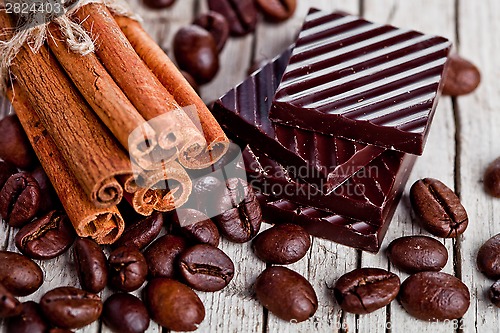 Image of chocolate sweets, cinnamon and coffee beans 