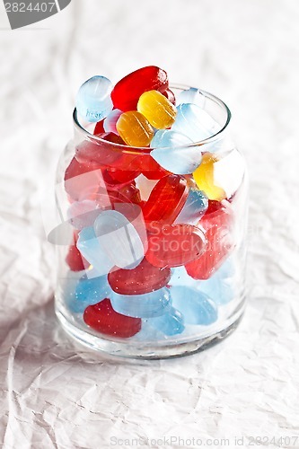 Image of colorful candies in glass jar 