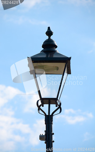 Image of Vintage street light against a blue sky