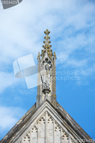 Image of Stone carving of St. Swithun on top of Winchester Cathedral