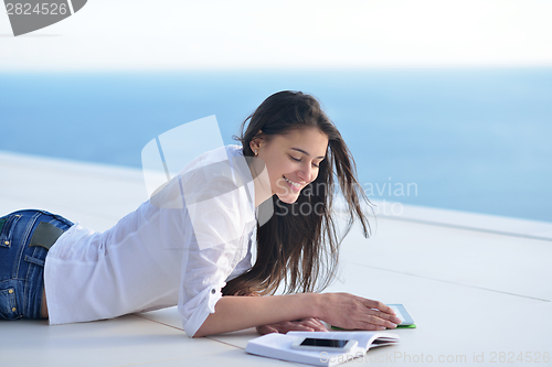 Image of relaxed young woman at home