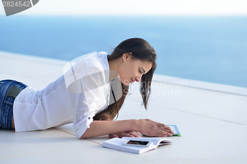 Image of relaxed young woman at home