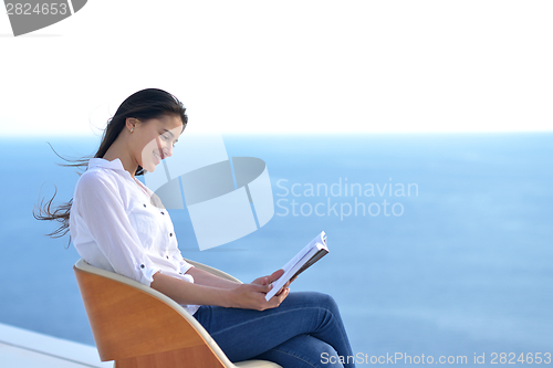 Image of relaxed young woman at home