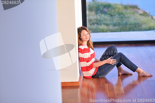 Image of relaxed young woman at home