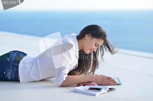 Image of relaxed young woman at home