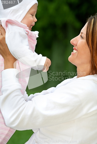 Image of happy mother with baby
