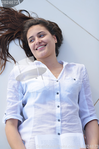 Image of relaxed young woman at home