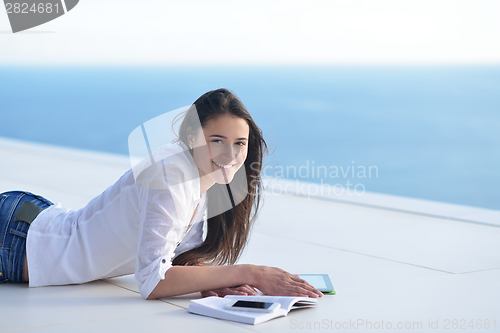 Image of relaxed young woman at home