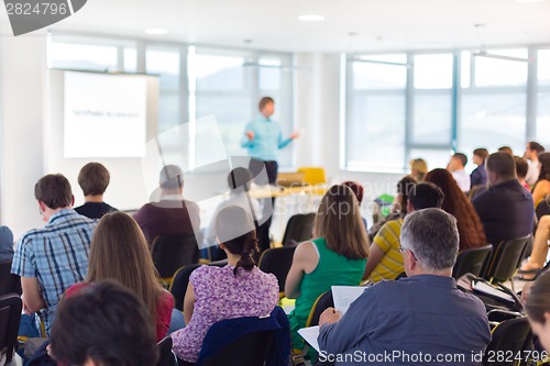 Image of Speaker at Business convention and Presentation.