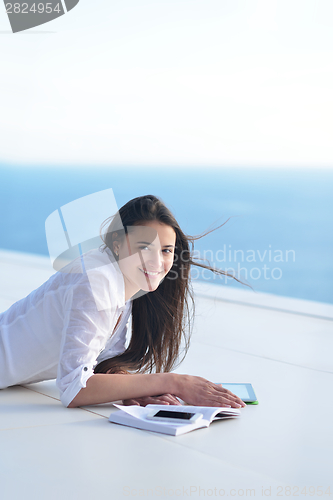 Image of relaxed young woman at home