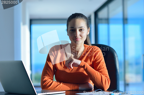 Image of relaxed young woman at home