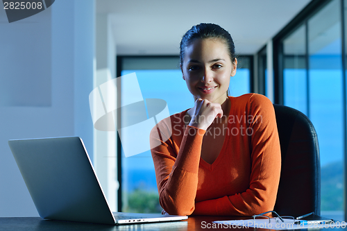 Image of relaxed young woman at home