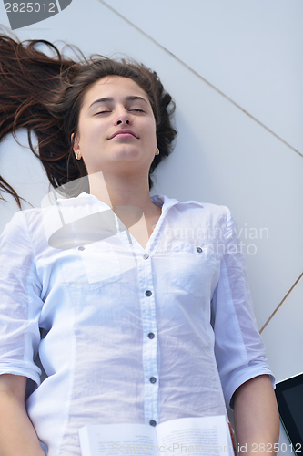 Image of relaxed young woman at home