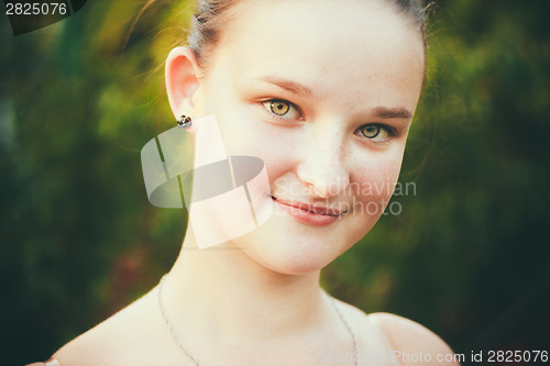 Image of Portrait Of Face Young Beautiful Girl Woman On Green Outdoor Bac