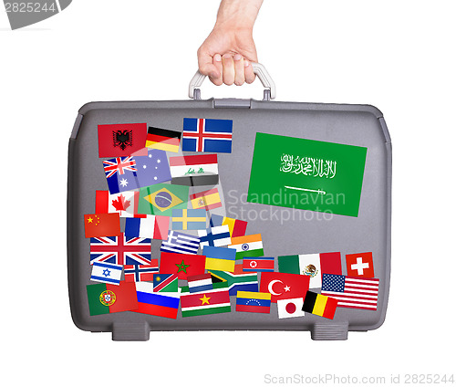 Image of Used plastic suitcase with stickers