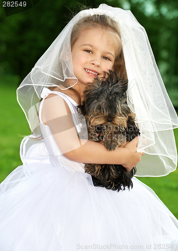 Image of little bridesmaid with cute dog