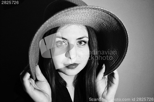 Image of Charming girl with pink hat black and white