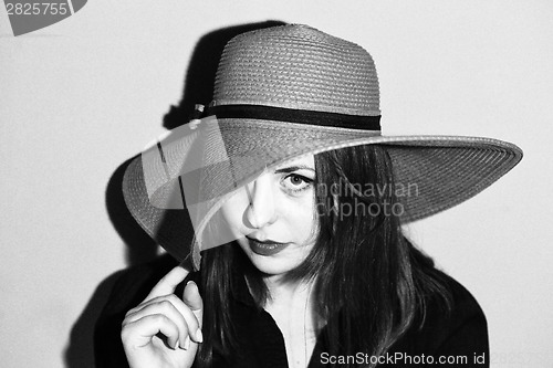 Image of Girl with pink hat black and white