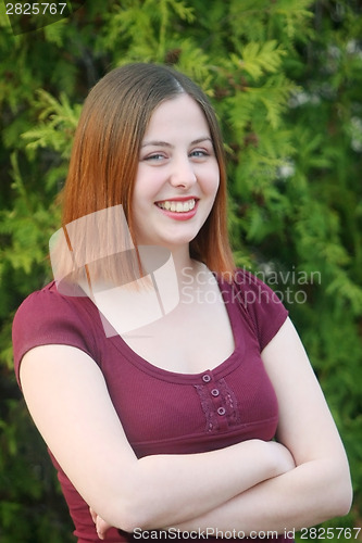 Image of Brunette posing outdoors