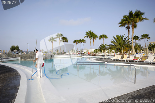 Image of Man cleaning pool