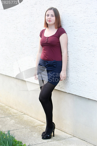 Image of Woman posing outside