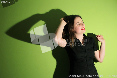 Image of Woman against green background