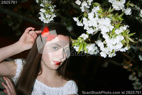 Image of Young woman and cherry blossom