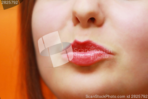 Image of Young woman puckering her lips