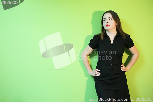 Image of Woman posing on green background