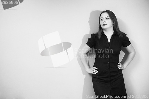 Image of Woman posing on green background black and white
