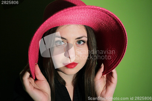 Image of Charming girl with pink hat