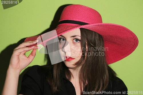 Image of Girl with pink straw hat